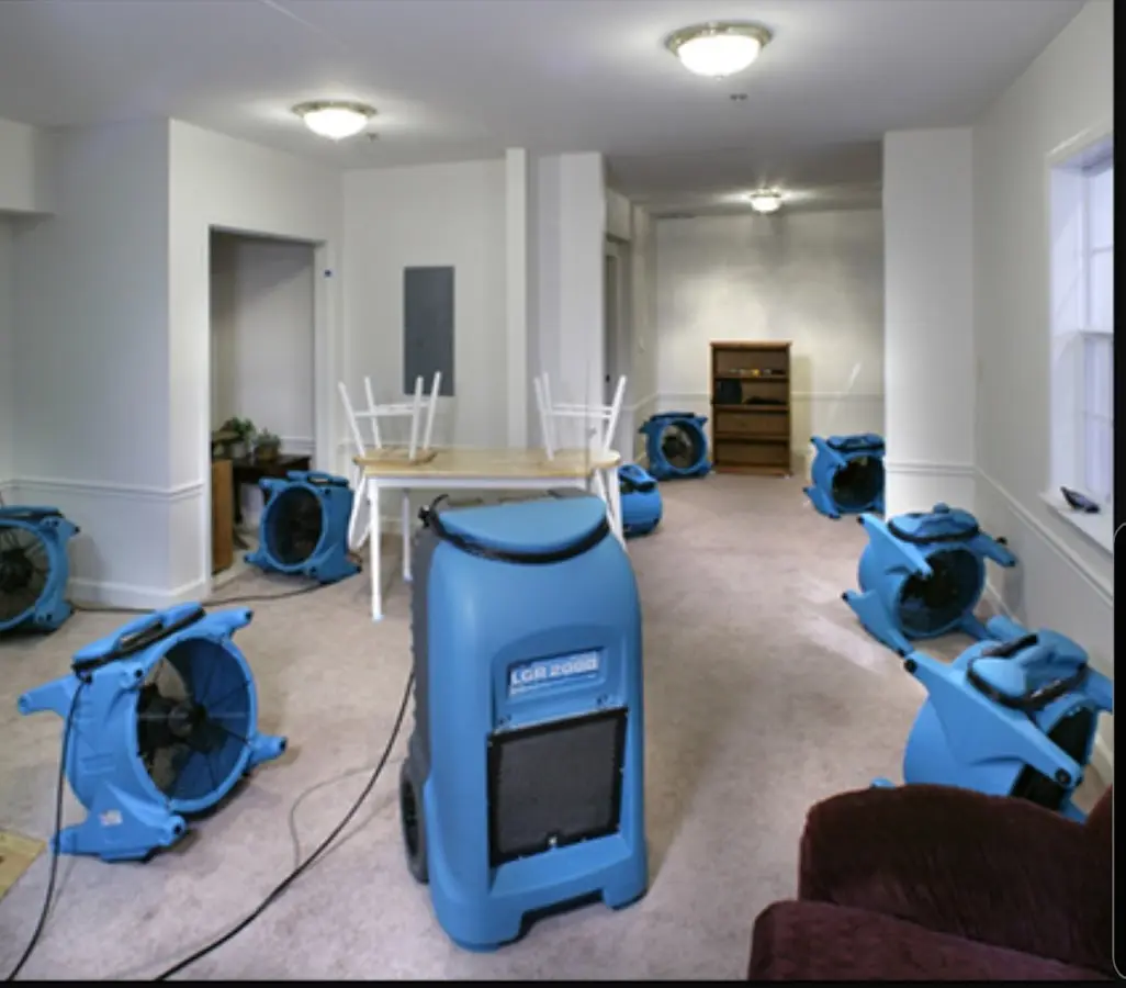 Air movers and dehumidifier setup for Water Damage Restoration in Benton